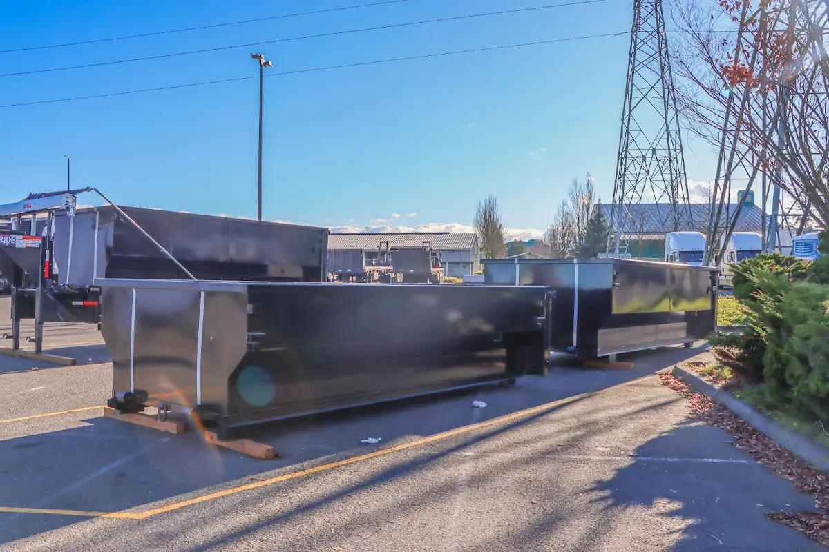 Roll-off dumpster ready for waste disposal at job site for 3 Yard Dumpster Rental in Cocoa Beach